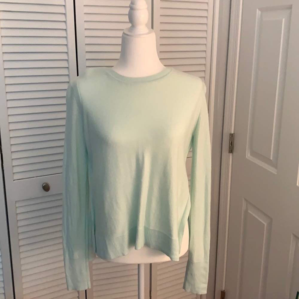 Seafoam colored light knit sweater with side slits
